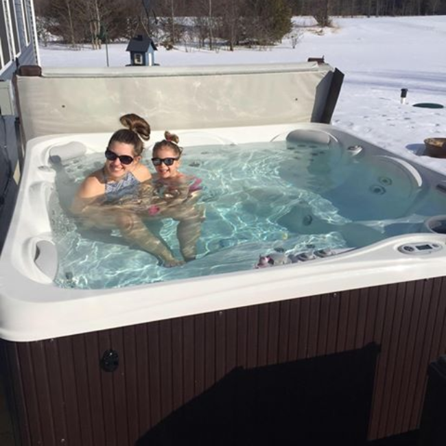 mom enjoying a hot tub 650 x 650